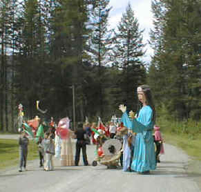 Giant Storyteller Parade Puppet with kids in local parade